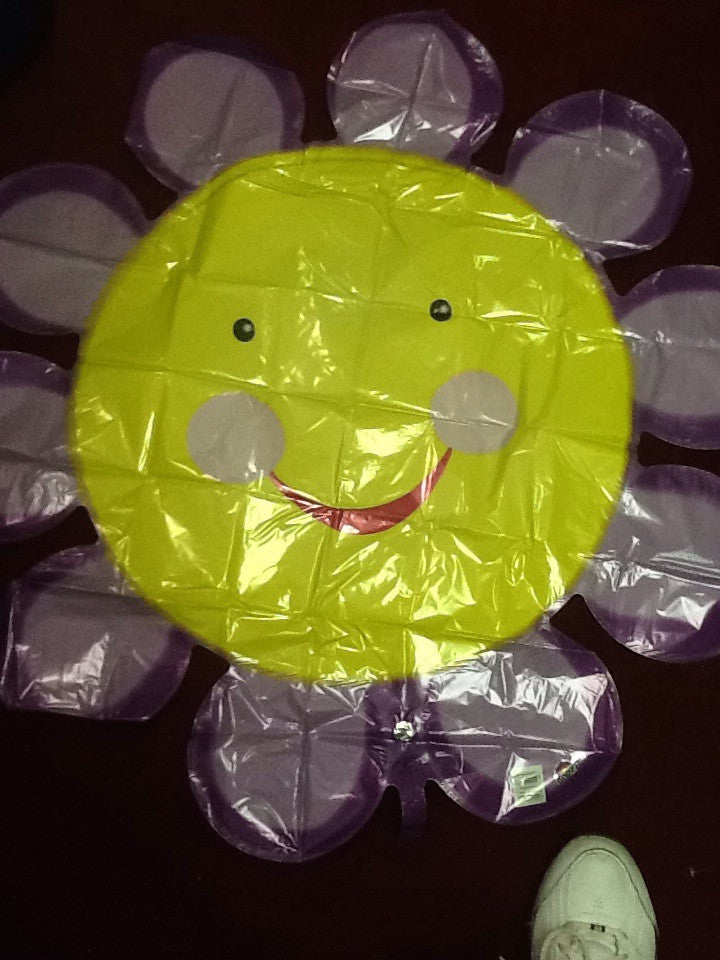 XL smiling purple flower - Titan Magic & Brain Busters Escape Rooms