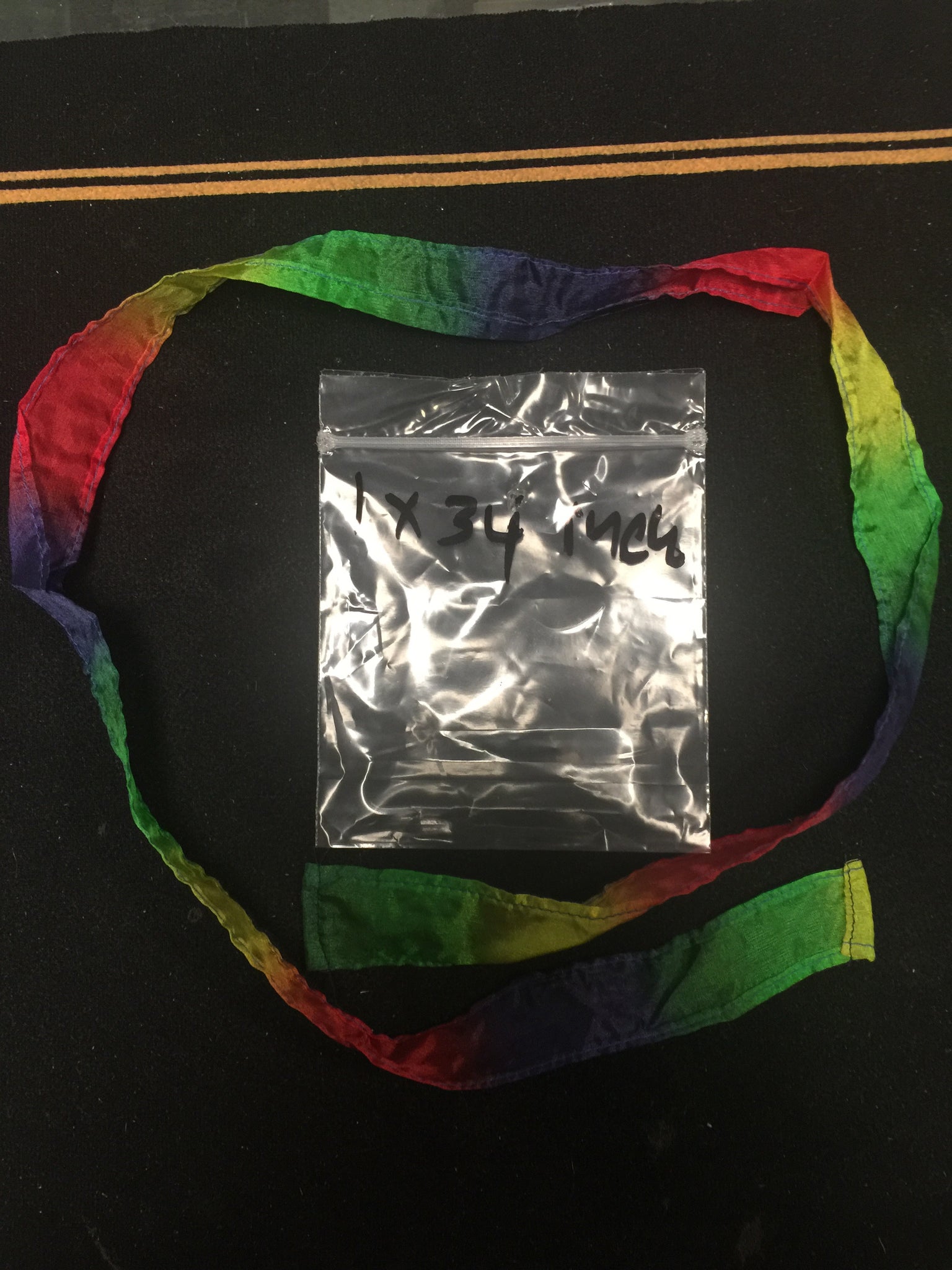 1x34 inch multi color thumb tip streamer - Titan Magic & Brain Busters Escape Rooms
